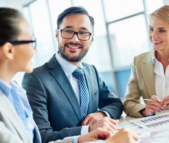 Advisors in suits talking to each other and clients